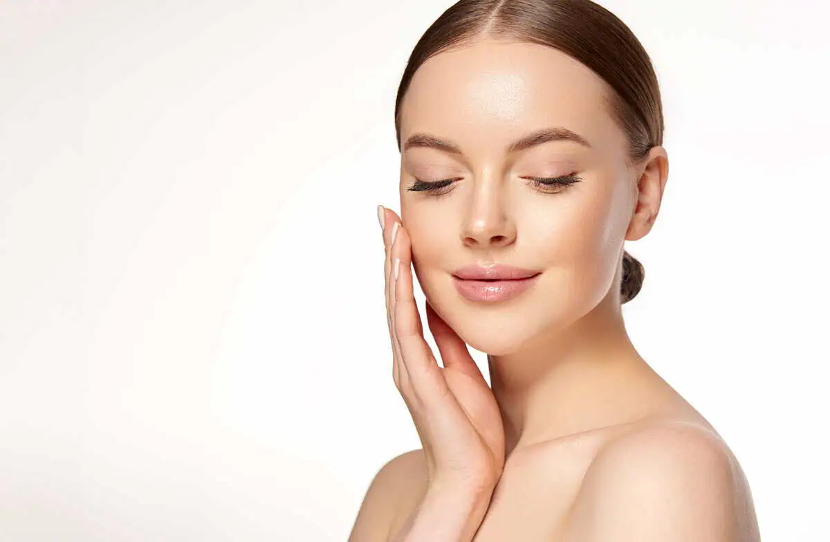 A woman is receiving cosmetic injectable treatments in Glow 365